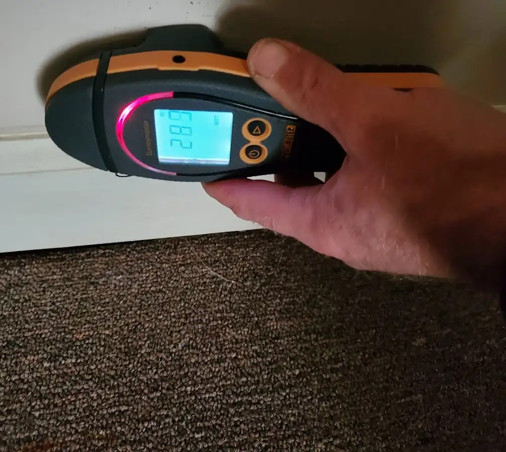 Moisture detection at baseboard during Storm Damage Restoration in Lakeland South